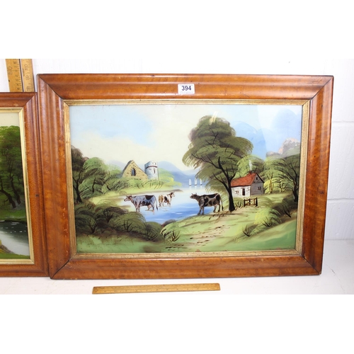 394 - A pair of Victorian reverse painted glass landscape paintings