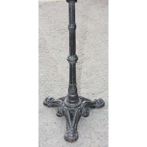 42 - Dark marble/ granite topped table with cast iron base