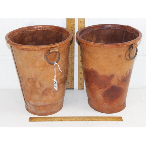 454 - A pair of leather planter buckets