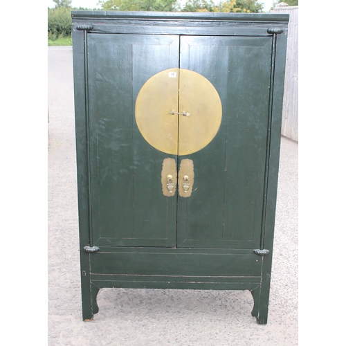 55 - A Chinese marriage cabinet with metal mounts, likely 19th or early 20th century, later green paintin... 