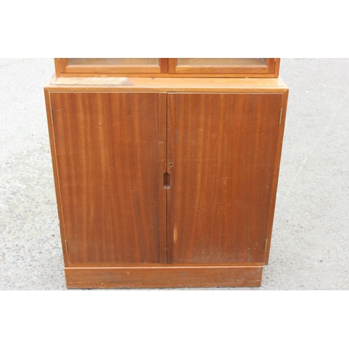 62 - A retro UKAEA Staverton cupboard with glazed bookcase top - dated 1958