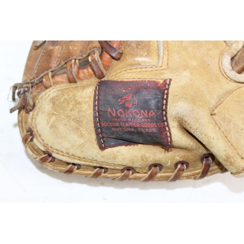 666 - Nokona baseball catcher's mitt and a softball ball