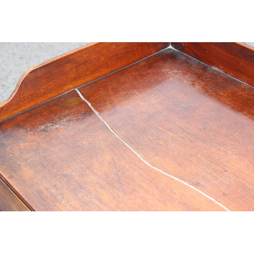 70 - A Victorian mahogany desk with drawer and lion head handles