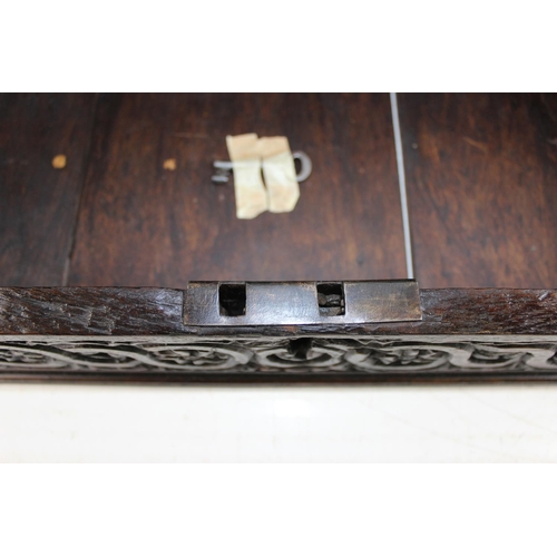 99 - A 17th/ 18th century carved wooden bible box with iron hinges