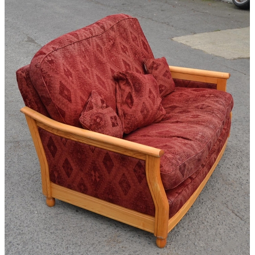 11 - Ercol blonde show frame 2 seater sofa with red fabric upholstery