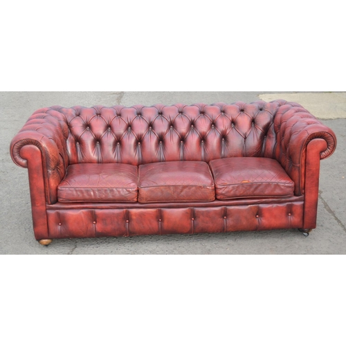 14 - An Ox Blood Red leather Chesterfield button back sofa