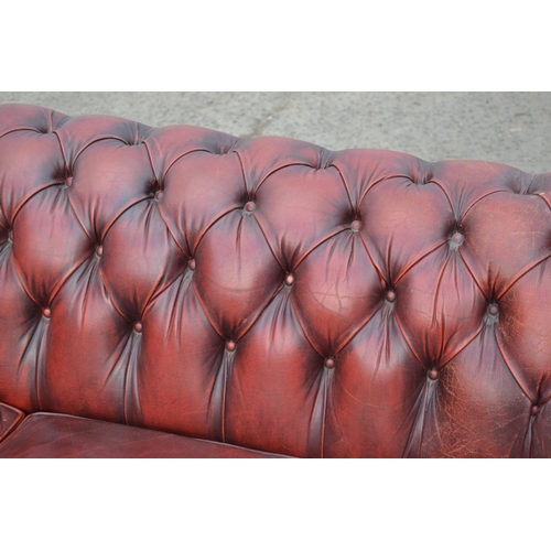 14 - An Ox Blood Red leather Chesterfield button back sofa