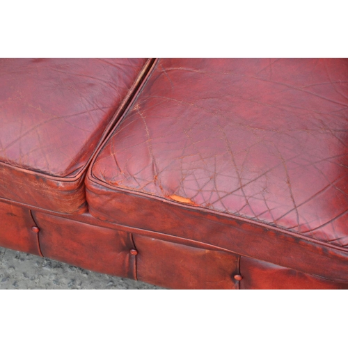 14 - An Ox Blood Red leather Chesterfield button back sofa