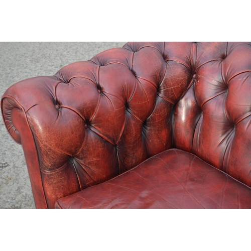 14 - An Ox Blood Red leather Chesterfield button back sofa