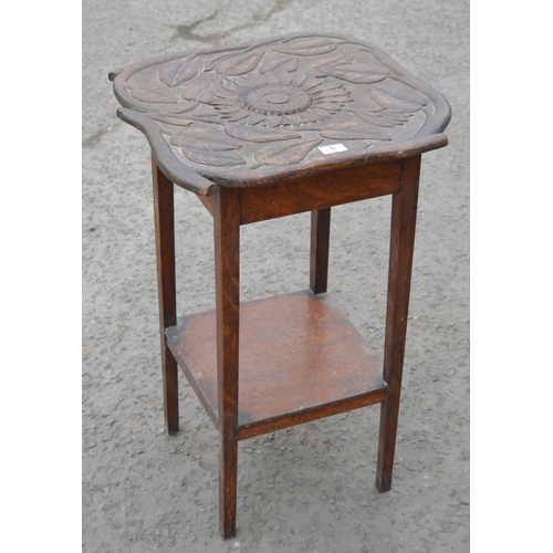 5 - An Arts & Crafts period carved oak side table