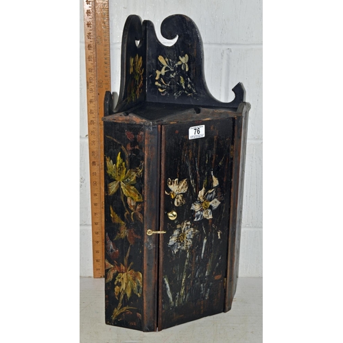 76 - An Arts & Crafts hanging cupboard with painted details