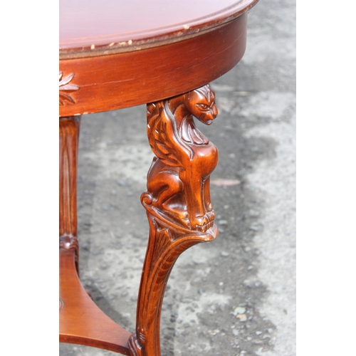 110 - Round mahogany table with Griffin leg details