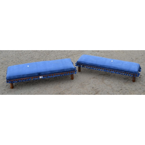 39 - A pair of vintage long low footstools with blue upholstery