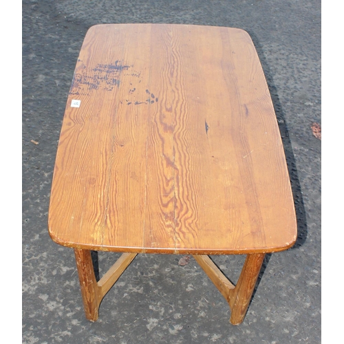 15 - A retro style pine coffee table with X stretcher
