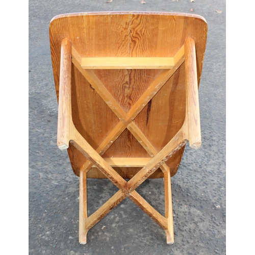 15 - A retro style pine coffee table with X stretcher
