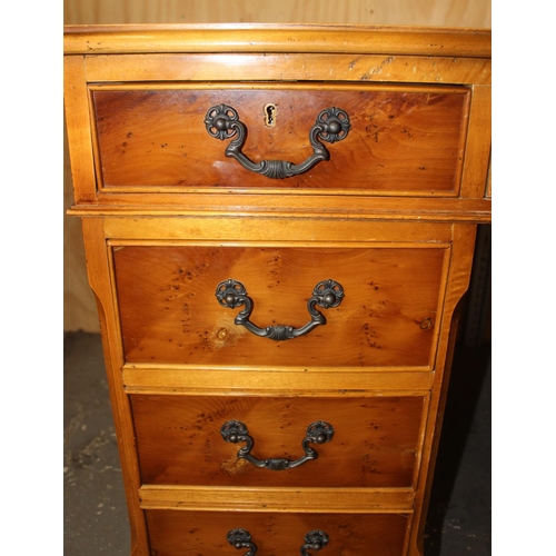 116 - Reproduction leather topped desk with 9 drawers