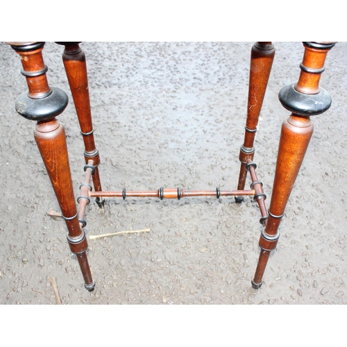 165 - A Victorian mahogany sewing table with turned legs and a floral marquetry inlaid top