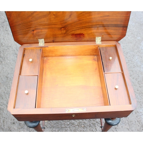 165 - A Victorian mahogany sewing table with turned legs and a floral marquetry inlaid top