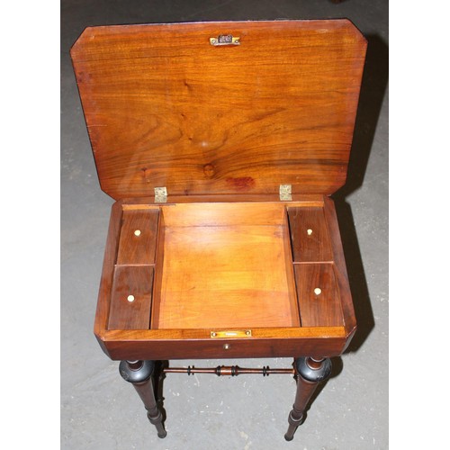 165 - A Victorian mahogany sewing table with turned legs and a floral marquetry inlaid top