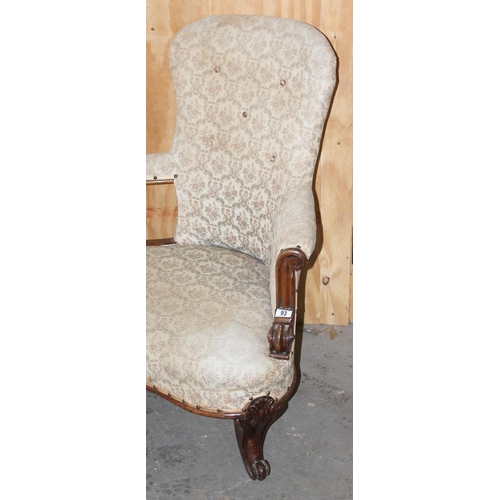 16 - Antique mahogany framed conversation couch with button back upholsters, likely 19th century