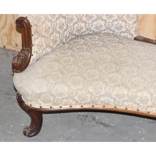 16 - Antique mahogany framed conversation couch with button back upholsters, likely 19th century