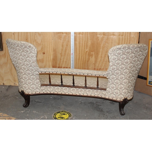 16 - Antique mahogany framed conversation couch with button back upholsters, likely 19th century