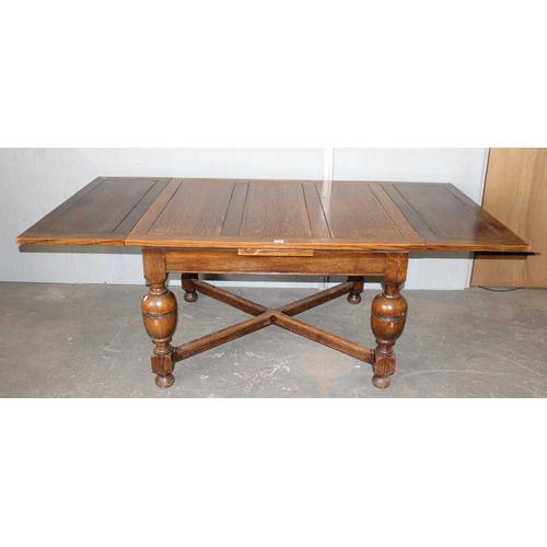 120 - A large Oak 17th century style extending dining table