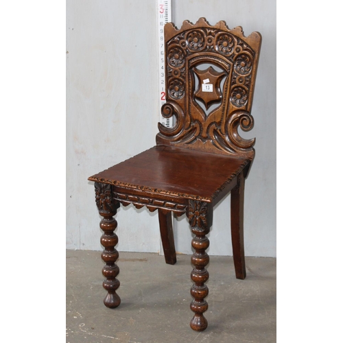 13 - An antique hall chair of unusual design with bobbin turned legs