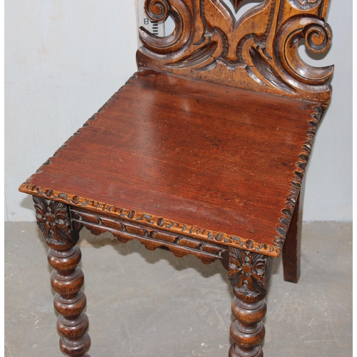 13 - An antique hall chair of unusual design with bobbin turned legs