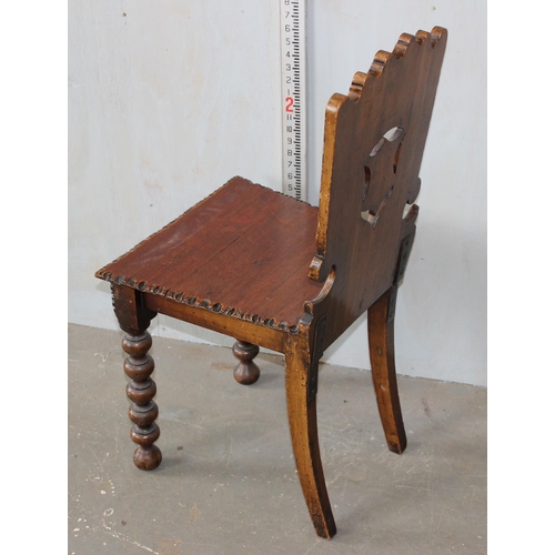 13 - An antique hall chair of unusual design with bobbin turned legs