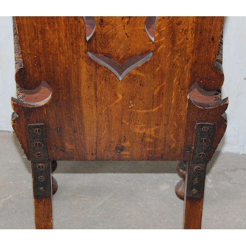 13 - An antique hall chair of unusual design with bobbin turned legs