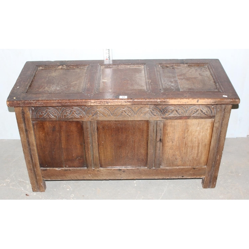 31 - Antique panelled coffer with carved details