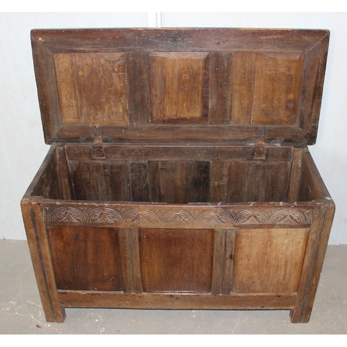 31 - Antique panelled coffer with carved details