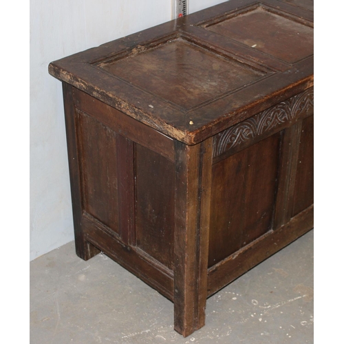 31 - Antique panelled coffer with carved details