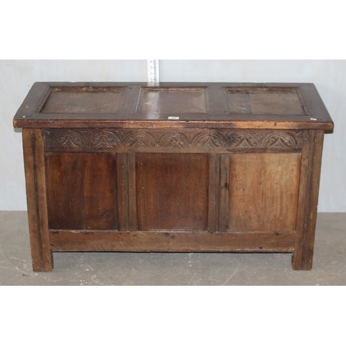 31 - Antique panelled coffer with carved details