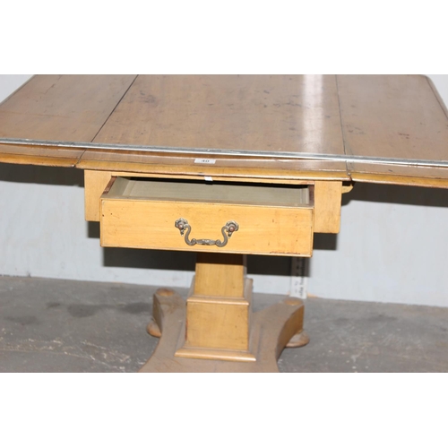 40 - An unusual antique drop leaf Pembroke table with drawer and pedestal base