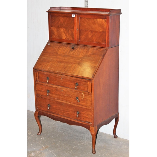 41 - An unusual early 20th century 3 drawer bureau with cupboard top