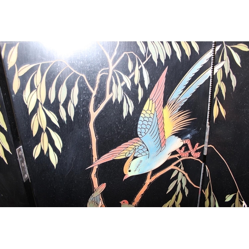 54 - A 20th century Chinese six fold dressing screen, painted or lacquer finish with textured scene of bi... 