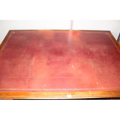 80 - A large Mahogany partners desk with Ox-Blood red leather gilt tooled top