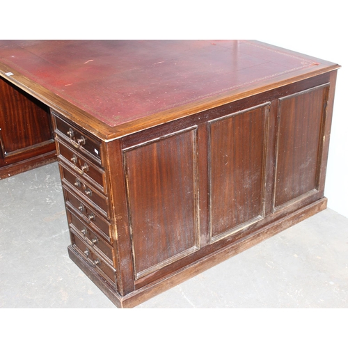 80 - A large Mahogany partners desk with Ox-Blood red leather gilt tooled top