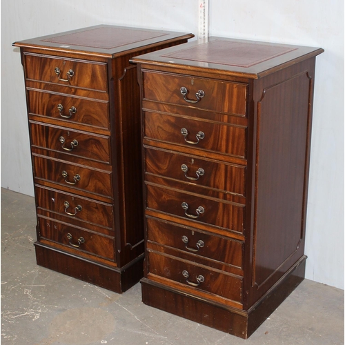 83 - A large pair of Mahogany effect office cabinets with Ox-Blood red leather gilt tooled top