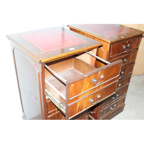 83 - A large pair of Mahogany effect office cabinets with Ox-Blood red leather gilt tooled top