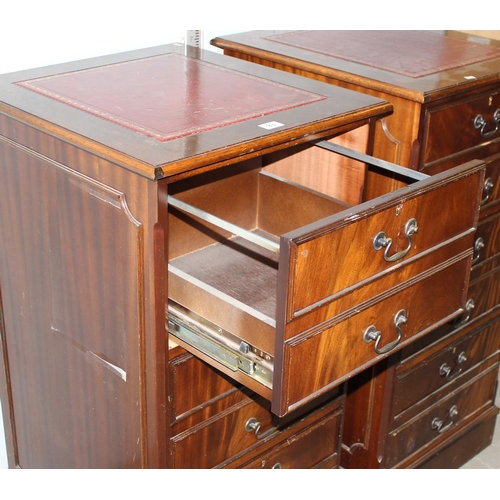 83 - A large pair of Mahogany effect office cabinets with Ox-Blood red leather gilt tooled top