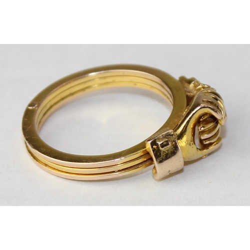 An unusual 14ct gold gimmel or fede ring with 3 fold out sections