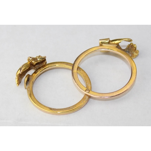 An unusual 14ct gold gimmel or fede ring with 3 fold out sections