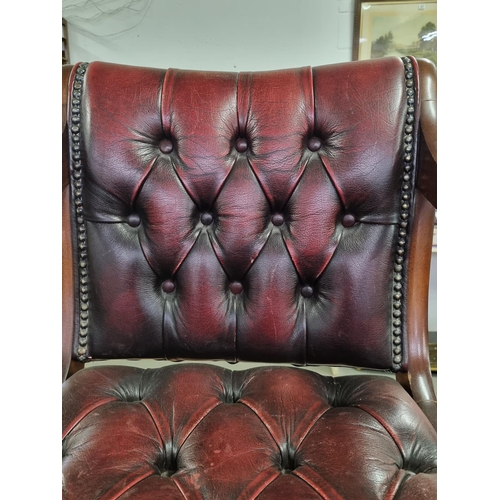 82 - A vintage Ox-Blood red Chesterfield leather desk or captain's swivel chair to match previous desk