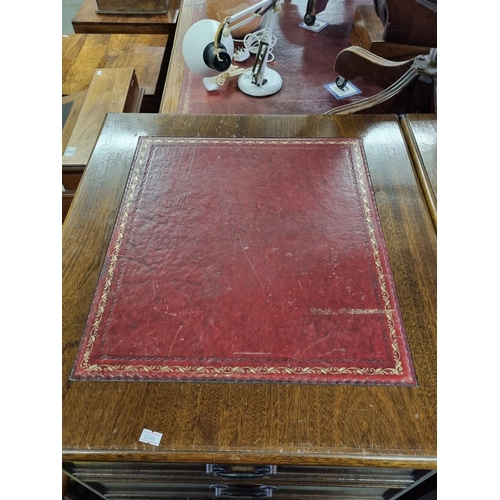 83 - A large pair of Mahogany effect office cabinets with Ox-Blood red leather gilt tooled top