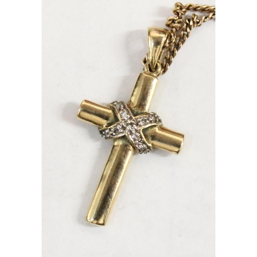 1200 - 9ct gold crucifix pendant on 9ct chain, the crucifix set with small diamonds, approx 20