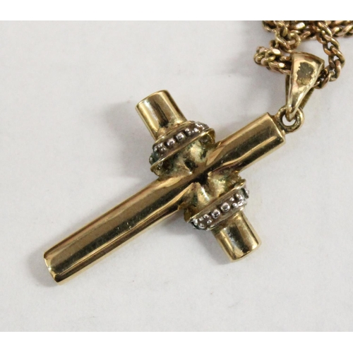 1200 - 9ct gold crucifix pendant on 9ct chain, the crucifix set with small diamonds, approx 20