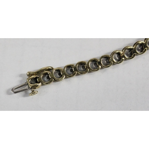 1201 - 9ct gold & diamond tennis bracelet, small diamonds set within an unusual crescent moon shaped settin... 